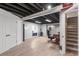 Finished basement with fireplace, office space, and access to stairs at 5332 S Lisbon Way, Centennial, CO 80015