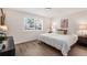 Bright bedroom with a large window, neutral decor, and comfortable furnishings at 5332 S Lisbon Way, Centennial, CO 80015