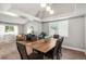 Well-lit dining room with hardwood floors, vaulted ceilings, and stylish lighting fixtures at 5332 S Lisbon Way, Centennial, CO 80015