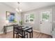 Cozy dining area with natural light, table set for two, and door leading to the backyard at 5332 S Lisbon Way, Centennial, CO 80015