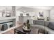 Open-concept living room flowing into the kitchen and dining area, perfect for entertaining at 5332 S Lisbon Way, Centennial, CO 80015