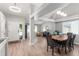 Open-concept living space with hardwood floors, recessed lighting, and modern design at 5332 S Lisbon Way, Centennial, CO 80015