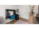 Office space with black desk, storage, and bright teal chair at 5332 S Lisbon Way, Centennial, CO 80015