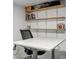 Functional office space featuring floating shelves and a Flexispot adjustable desk at 6376 E Mississippi Ave, Denver, CO 80224