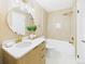Bright bathroom featuring modern fixtures, a shower-tub combo, and a stylish vanity with storage at 7205 S Gaylord St # G, Centennial, CO 80122