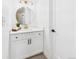 Elegant bathroom features white cabinetry, modern fixtures, and a clean, minimalist aesthetic at 7205 S Gaylord St # G, Centennial, CO 80122