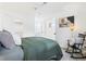 Cozy bedroom featuring stylish decor, plush bedding, and plenty of natural light at 7205 S Gaylord St # G, Centennial, CO 80122
