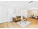 Bright living room/dining room featuring a leather sofa, wood floors, and dining table at 7205 S Gaylord St # G, Centennial, CO 80122