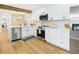 Bright kitchen boasts white cabinets, stainless appliances, and modern fixtures for a clean, updated look at 7205 S Gaylord St # G, Centennial, CO 80122