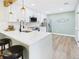 Modern kitchen featuring white cabinetry and a breakfast bar with seating at 7205 S Gaylord St # G, Centennial, CO 80122