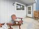 Cozy covered patio with wooden chairs, offering a relaxing outdoor space at 7205 S Gaylord St # G, Centennial, CO 80122