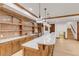 Finished basement bar with wood bar, white countertop, brick backsplash, stainless steel appliances, and hardwood floors at 1525 W 141St Way, Westminster, CO 80023