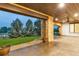Covered patio with stone columns, recessed lighting, ceiling fan and view of the green lawn and landscaping at 1525 W 141St Way, Westminster, CO 80023