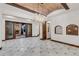 Dining room with elegant chandelier, brick ceiling and access to the outdoor stone fireplace at 1525 W 141St Way, Westminster, CO 80023