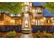 Grand entrance of home with stone accents, arched doorway, and manicured landscaping creating curb appeal at 1525 W 141St Way, Westminster, CO 80023
