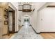 Spacious foyer with marble floors, wood trim, and elegant lighting creating a luxurious first impression at 1525 W 141St Way, Westminster, CO 80023