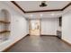 Spacious game room with built-in shelves and cabinetry, and french door access to other living spaces at 1525 W 141St Way, Westminster, CO 80023