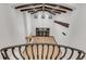 Grand living room with high ceilings, wooden beams, a fireplace, and large windows, creating a bright and inviting atmosphere at 1525 W 141St Way, Westminster, CO 80023