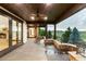 Covered patio with stone columns, ceiling fan, railing and stone fireplace at 1525 W 141St Way, Westminster, CO 80023