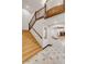 Staircase with natural wood steps and railings, connecting the home's levels with elegance and style at 1525 W 141St Way, Westminster, CO 80023