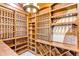 Custom wine cellar with individual wine racks and diamond storage plus display shelving and brick accents at 1525 W 141St Way, Westminster, CO 80023