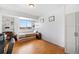 Small bedroom with cork flooring and built-in shelving at 800 N Washington St # 710, Denver, CO 80203