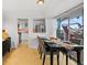 Elegant dining area with a table and chairs near a balcony at 800 N Washington St # 710, Denver, CO 80203