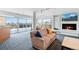 Bright living room with fireplace, city views, and comfortable seating at 800 N Washington St # 710, Denver, CO 80203