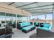 Spacious rooftop deck with city views, wicker furniture, and a retractable awning at 800 N Washington St # 710, Denver, CO 80203