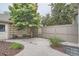 Secluded backyard showcasing mature landscaping, including decorative trees and privacy fencing at 222 S Monroe St, Denver, CO 80209