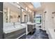 Modern bathroom featuring double sinks, a spacious mirror, and sleek gray cabinetry at 222 S Monroe St, Denver, CO 80209