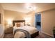 Serene bedroom with inviting bedding, stylish lamps, and easy access to a refreshment area or kitchen at 222 S Monroe St, Denver, CO 80209