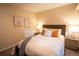 Inviting bedroom with cozy bedding, stylish lamps, and tasteful wall art, perfect for relaxation at 222 S Monroe St, Denver, CO 80209