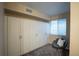 Large storage closet with custom built-in shelves, modern window, and cozy sitting chair at 222 S Monroe St, Denver, CO 80209