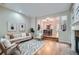 Bright living room with hardwood floors, fireplace, and an open floor plan to the dining area at 222 S Monroe St, Denver, CO 80209