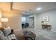 Cozy living room featuring modern furniture, open shelving, and stylish décor in a neutral color palette at 222 S Monroe St, Denver, CO 80209