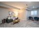 Comfortable living room with a sofa, chairs, stylish coffee table, and large window allowing ample natural light at 222 S Monroe St, Denver, CO 80209