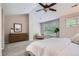 Spacious main bedroom with a large window, dresser, and comfortable seating area at 222 S Monroe St, Denver, CO 80209