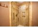 A tiled shower with a glass enclosure and built-in shelving units provides a clean and luxurious bathing experience at 222 S Monroe St, Denver, CO 80209