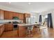 Well-equipped kitchen featuring stainless appliances, a central island, and modern finishes at 22046 E Allenspark Pl, Aurora, CO 80016
