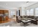 Bright living area with hardwood floors that open to a dining area and a cozy living room at 22046 E Allenspark Pl, Aurora, CO 80016