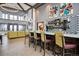 Charming lounge area with bar seating, modern decor, and stylish lighting at 22046 E Allenspark Pl, Aurora, CO 80016