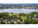 Stunning aerial view of the lake showcasing the surrounding cityscape and lush greenery at 2957 Osceola St, Denver, CO 80212
