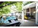 Inviting outdoor living space with comfortable seating and view of interior fireplace at 2957 Osceola St, Denver, CO 80212