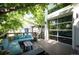 Inviting outdoor living space with comfortable seating and a large sliding glass door at 2957 Osceola St, Denver, CO 80212