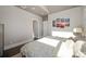 Bright bedroom with hardwood floors and a comfortable bed with a decorative headboard at 2957 Osceola St, Denver, CO 80212
