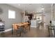Spacious dining room featuring modern light fixtures and hardwood floors at 2957 Osceola St, Denver, CO 80212