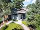 Attractive home featuring a modern design, well-kept lawn, and inviting entryway with landscaped surroundings at 2957 Osceola St, Denver, CO 80212