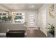 Bright foyer featuring modern lighting, stylish front door, and contemporary decor, creating an inviting entry at 2957 Osceola St, Denver, CO 80212