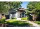 Charming single-Gathering home with a modern design, lush landscaping, and inviting entry at 2957 Osceola St, Denver, CO 80212
